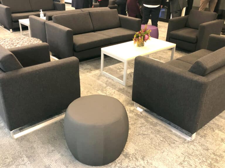 Main lounge area - pebble ottoman with Cason 2 seater lounge on a sled base
